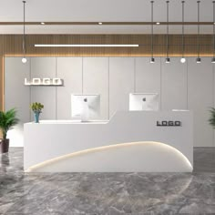 an office lobby with white counter and planters on the wall, along with lights hanging from the ceiling