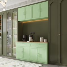 a kitchen with green cabinets and white rug