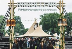 a group of people standing under a tent