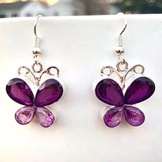 Light And Dark Purple Gems On Silver Drop Butterfly Earrings! Fishhook Styling. Manmade Gems. Measures 7/8 Inch Tall And 3/4 Inch Wide. New From Package. Also Available In Pink Sold Separately In My Closet. All Measurements Are Approximate. Purple Metal Crystal Earrings As Gift, Purple Crystal Metal Earrings For Gifts, Purple Metal Crystal Earrings For Gift, Adjustable Silver Crystal Earrings As Gift, Gem Butterfly, Purple Gems, Light And Dark, Purple Butterfly, Butterfly Earrings