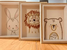 three framed pictures with animals in them