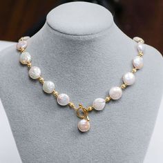 Celebrate your love for all things vintage with this handmade baroque pearl matching set. Each shimmering white cultured pearl features a unique shape, making these pearls a true treasure from the sea to cherish. Shiny, rich yellow gold plated spacer beads interplay with the pearls, creating a fusion of classic meets trendy style. Elongated hook clasps close the necklace, adding a luxurious touch. Created with an antique inspiration, purchase this set together or separately and showcase their el Luxury Elegant Baroque Pearl Beaded Necklaces, Gold Pearl Toggle Necklace, Coin Pearl Necklace, Button Necklace, Toggle Necklace, Necklace Patterns, Pearl Jewelry Necklace, Baroque Pearl Necklace, Coin Pearls