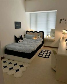 a bedroom with a bed and desk in it