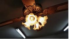 a ceiling fan with three lights on it