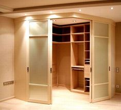 an empty walk in closet with sliding doors