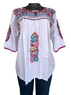 Mexican Embroidered Top.  Beautiful and rich embroideries.   The top would be used as casual or for fiesta cultural event.  Measurement: Medium Neck depth: 5 inches Neck Circumference: 28 inches Under Arm Circumference:  26 Inches Sleeve  Length: 13 inches   Sleeve Width: 12 inches Bust Circumference: 34 inches Waist Circumference: 52 inches Length: 27 Inches Pre washed, will not shrink. Care: Machine Wash/Tumble dry If you have any question, I will be happy to assist you. Shipping Method: My first priority is to provide an excellent service.  During peak shipping season delays are expected, please apologize for any inconvenience shipping service could cause. I will always do my best to ship the item as soon as possible.  Thank you very much for your business. Folk Peasant Top With Multicolor Embroidered Neckline, Traditional Embroidered Multicolor Peasant Top, Multicolor Embroidered Peasant Top, Peasant Top With Multicolor Embroidery, Peasant Top With Multicolor Embroidery And Embroidered Hem, Traditional White Peasant Top With Embroidered Neckline, Traditional White Peasant Top With Intricate Embroidery, Embroidered Multicolor Peasant Top For Festival, Festival Peasant Top With Multicolor Embroidery