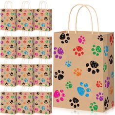 a paper bag with dog paw prints on it and six bags in different colors to choose from