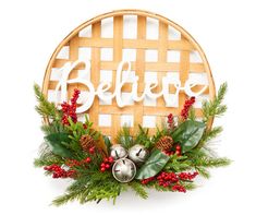 a christmas wreath with bells and greenery around it that says believe in white letters