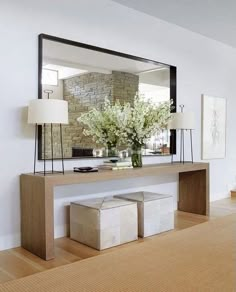 a large mirror sitting above a wooden table