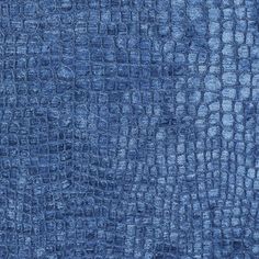 a blue rug with crocodile skin on it