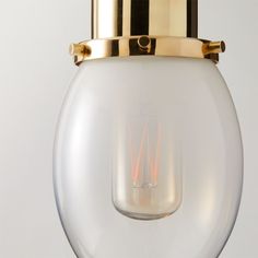 Inspired by French industrial fixtures, the Lille glass pendant by goop offers a surprising mix of materials. Suspended from a rose gold cloth cord, a drop of ombre glass encases the bulb, topped with an unlacquered brass cap. The gentle transition to clear glass softens the design with a feminine edge-a Gwyneth Paltrow design signature. Polished unlacquered brass hardware offers a living finish that will develop the patina of a vintage find. CB2 exclusive.Due to the nature of the material, bras Industrial Fixtures, Unlacquered Brass Hardware, Silver Lamp, China Dinnerware Sets, French Industrial, Gold Pendant Lighting, Bone China Dinnerware, Ceramic Dinnerware Set, Gold Table Lamp