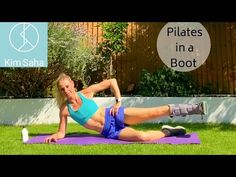 a woman is doing an exercise on a purple mat in the grass with her legs spread out