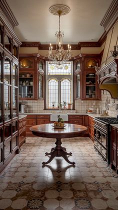 a large kitchen with an oval table in the center