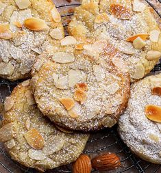 almond cookies with powdered sugar and nuts on a cooling rack, ready to be eaten