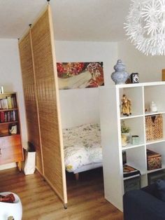 a living room filled with furniture and a book shelf