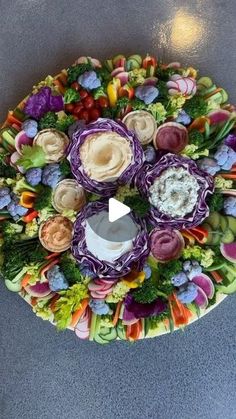 an arrangement of flowers arranged on a platter