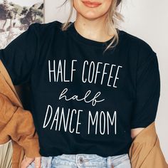 a woman wearing a black shirt that says half coffee half dance mom