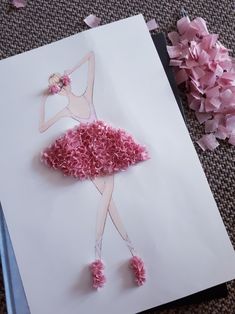 a piece of paper that has been made to look like a ballerina