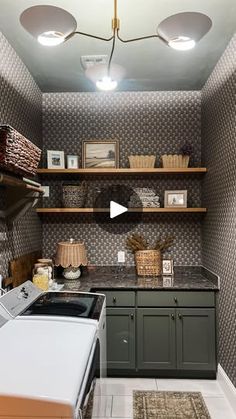 a washer and dryer sitting in a room next to a shelf with baskets on it