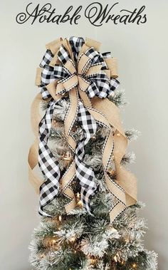 a christmas tree decorated with black and white plaid ribbon