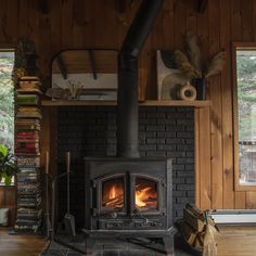 a wood burning stove sitting inside of a living room