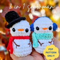 two small crocheted snowmen with hats and scarves on their faces are shown