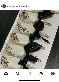 there are six cake pops with black and gold decorations on them, each decorated like a shoe