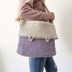 - Crochet messenger bag handmade in the UK using 100% cotton.  - Our bags are both durable and washable at 30 degrees, purposefully designed to be a long lasting new staple of any wardrobe.  - The simple and unique style is perfect for anyone of any age, suiting most styles and occasions. - The satchel style bag is fastened with two wooden buttons on the front which say "handmade with love".  - Either side of the strap on the bag are small wooden buttons, which are perfect for attaching bag char Everyday Lavender Rectangular Shoulder Bag, Casual Purple Shoulder Bag Satchel, Casual Purple Shoulder Satchel, Purple Cotton Tote Shoulder Bag, Crochet Satchel Shoulder Bag, Cotton Crochet Shoulder Bag For Travel, Handmade Cotton Backpack, Purple Cotton Tote Bag, Handmade Cotton School Bag