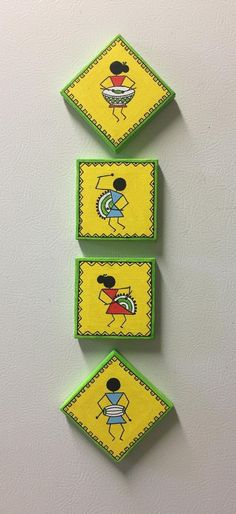 three yellow and green magnets with pictures on them