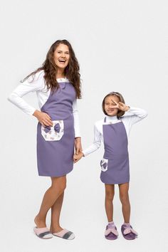 Looking for a purple matching cotton apron set that's perfect for mothers and daughters, ideal for baking, cooking, crafting, and more? This beautiful mom and daughter apron set offers stylish comfort, featuring elegant floral details and made from the purest natural cotton. Designed with pockets for practicality and the option to embroider personalized details, these aprons are perfect for creating lasting memories in the kitchen together! Gift from me - two cozy matching hair ribbons. Crafted Mother Daughter Aprons Mommy And Me, Big Sister Apron, Mother Daughter Apron, Personalized Kids Apron, Hair Ribbons, Cotton Apron, Personalized Embroidered, Linen Apron, Mother Daughter