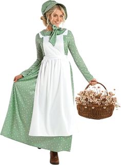 a woman dressed in a green and white dress holding a basket with flowers on it