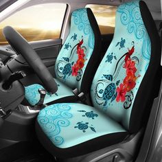 the interior of a car with blue and red flowers on it's seat covers