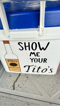 a cooler with the words show me your tios painted on it's side