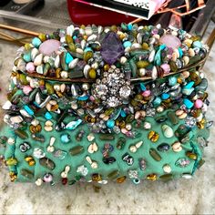 Never Used Beautiful Jeweled Bag. Has Strap To Wear Multiple Ways. Luxury Green Clutch For Shopping, Luxury Turquoise Evening Bag, Elegant Turquoise Bag With Removable Pouch, Chic Embellished Blue Bag, Elegant Turquoise Shoulder Bag, Designer Embellished Multicolor Bags, Chic Blue Embellished Bag, Designer Multicolor Embellished Bags, Chic Embellished Green Bags