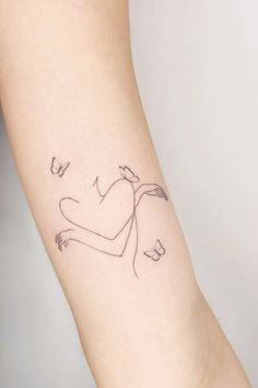 a woman's arm with a small tattoo on the left side of her body