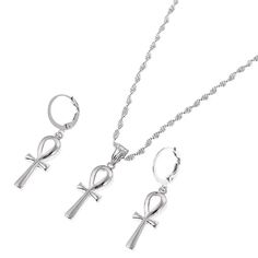 Embrace the timeless allure of ancient Egypt with our Silver Egyptian Ankh Cross Jewelry Set. Meticulously crafted, this set features an exquisite Egyptian Ankh Cross Pendant accompanied by complementing accessories. The sleek silver color accentuates the elegant design, paying homage to the symbol of eternal life and vitality. Jewelry Sets Type: Necklace/Earrings Item Type: Jewelry Sets We ship worldwide to 185 countries! Please allow 1-2 business weeks for your order to arrive. Symbolic Sterling Silver Ankh Necklaces, Silver Ankh Symbolic Necklace, Gothic Ankh Necklace In Metal, Ancient Egypt Jewelry, Black Ankh Necklace In Metal, Cheap Ankh-shaped Spiritual Necklaces, Egypt Jewelry, Cross Earrings, Cross Jewelry