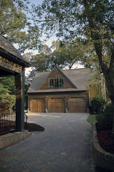 a driveway leading to a large house