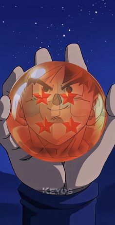 a cartoon character holding up a glass ball with stars on it