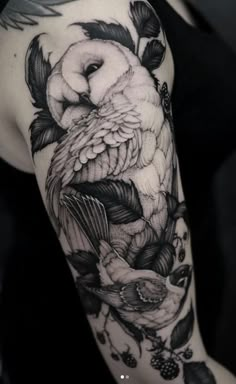 an owl and birds tattoo on the arm