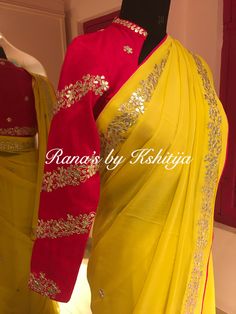 Pure georgette saree with fine gota worked bale design throughout the border of the saree. The saree looks attractive because of the contrast hot pink color. The blouse is smart collar blouse with full sleeve. Changes can be done if needed. You can mention it separately. Product Highlights: Fabric: Pure Georgette and Pure Raw Silk Embroidery: Gota Patti Color: Yellow and Pink Ships in 3 weeks Free Service: The saree is well finished with backing and edges in hot pink. The saree has handmade latkans on pallu. Any Questions? You can message / WhatsApp us at: +91-70239-53082 Pink Blouses Outfit, Raw Silk Embroidery, Sari Blouses, Saree Looks, Pure Georgette Sarees, Full Sleeve Blouse, Saree Designs Party Wear, Hot Pink Color, Indian Wedding Wear