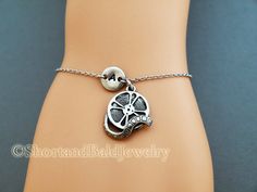 "❖ Film Reel charm: Antique silver pewter. Approx. 6/8\" ❖ Hand Stamped Initial Charm: Antique Silver Pewter. 3/8\" (9mm) Charms are lead free, made in U.S.A. ❖ Bracelet length: 6 & 1/4\" plus 1 & 1/2\" adjustable links = 7 & 3/4\" ❖ No extra charge up to 10\" - Contact me! ❖ Click below for Film Reel charm bracelet in Antique Gold Pewter: https://www.etsy.com/listing/128568080 ❖ Click below for Film Reel charm necklace: https://www.etsy.com/listing/120541105 ❖ Add a birthstone or Fr Vintage Adjustable Jewelry For Mother's Day, Silver Vintage Jewelry For Friendship, Personalized Adjustable Metal Charm Bracelet, Vintage Adjustable Hypoallergenic Jewelry, Adjustable Metal Charm Bracelet For Anniversary, Adjustable Engraved Charm Bracelet For Mother's Day, Antique Silver Nickel-free Charm Bracelet For Gift, Antique Silver Charm Bracelet As Gift, Adjustable Charm Bracelet Best Friend Gift