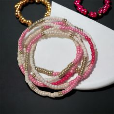 5pcs Beaded Pink Gold And White 7in Bracelet Summer Hand-strung Pink Beads, Summer Pink Hand-strung Beads, Adjustable Pink Beaded Bracelets With Gold Beads, Pink Tiny Beaded Bracelets For Party, Pink Stretch Bracelet With Tiny Beads, Pink Tiny Beads Stretch Bracelet, Pink Beaded Stretch Bracelet For Party, Pink Letter Beads Bracelet For Party, Pink Stretch Bracelet For Beach Wear