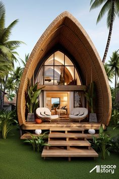 an unusual house in the middle of palm trees