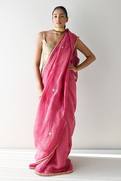 Hot pink chanderi silk and tissue pin stripe saree with scattered floral butti embroidery using cutdana, sequins and elevated by golden lace trims. - Aza Fashions Festive Pink Raw Silk Pre-draped Saree, Pink Raw Silk Pre-draped Saree With Resham Embroidery, Slub Silk Pre-draped Saree With Zari Work For Puja, Elegant Pink Pre-draped Saree In Tussar Silk, Pink Pre-draped Saree With Dupatta In Tissue Silk, Pink Pre-draped Saree With Gota Work, Transitional Pink Raw Silk Pre-draped Saree, Pink Raw Silk Pre-draped Saree With Dupatta, Pink Silk Pre-draped Saree With Cutdana