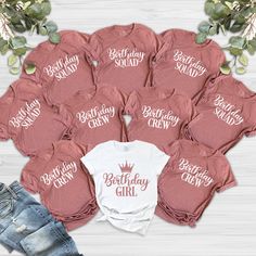 a bunch of shirts with the words birthday girl printed on them and some denim shorts