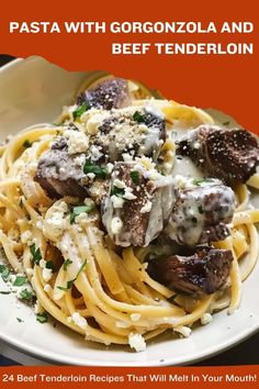 pasta with gorgonzolla and beef tenderloin on a white plate topped with parmesan cheese