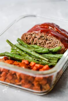 meatloaf with green beans and carrots in a glass container