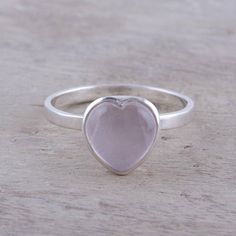 Carved of soft pink rose quartz, a gemstone heart crowns this cocktail ring from India, designed by Anjali Sharma. Local artisans handcraft the ring of sterling silver with a high-polish finish, bringing a romantic air wherever it goes. Pink Sterling Silver Moonstone Promise Ring, Pink Moonstone Sterling Silver Ring For Anniversary, Silver Heart-shaped Rose Quartz Jewelry, Silver Rose Quartz Heart Jewelry, Rose Quartz Color, Heart Crown, Pink Rose Quartz, Rose Quartz Heart, Heart Gemstone