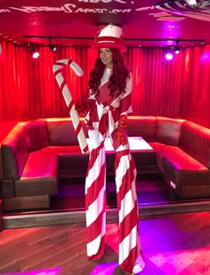 a woman dressed in a candy cane costume