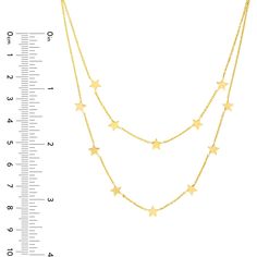 Cherish the blend of style and substance with the mesmerizing charm of the Double Strand Star Station Adj. Necklace from Olas d'Oro. This exquisite 14K yellow gold necklace is a celestial masterpiece that will leave you starry-eyed. Its dual strands gracefully encircle your neck, adding a touch of celestial elegance to your look.Crafted with precision, this necklace is more than just jewelry; it's a symbol of your unique style and sophistication. The star station duet design adds a playful yet e Double Necklace, 14k Yellow Gold Necklace, Starry Eyed, Yellow Gold Necklace, Tennis Necklace, Gold Shimmer, Adjustable Necklace, Metal Necklaces, Eternity Bands